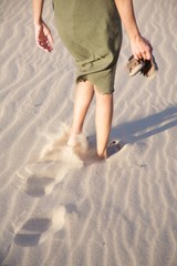 woman walking and footprints