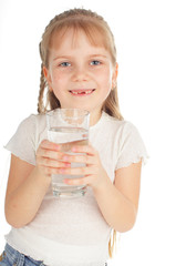 Child with a glass of pure water