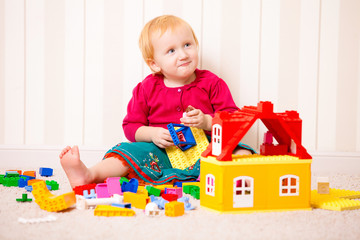 Child plays with bricks