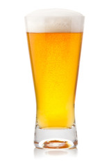 Beer into glass isolated on white