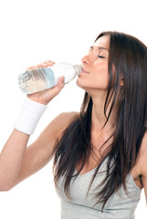 Girl drinking pure water from a bottle