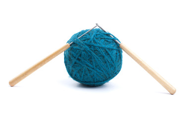 blue ball of yarn with knitting needles