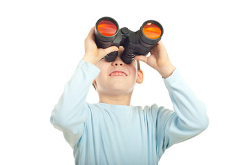 Kid boy looking into binocular