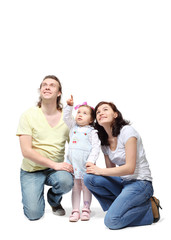 Happy mother and father sit down and embrace little daughter