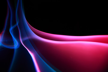 Abstract colorful waves on black background