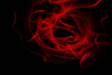 Abstract colorful lines on black background, red freezelight