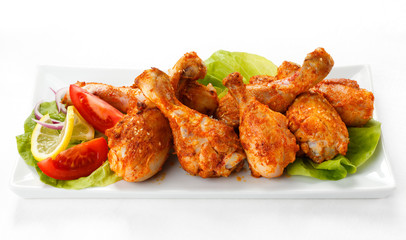 Roasted chicken drumsticks and vegetables