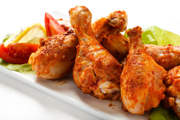 Roasted chicken drumsticks and vegetables