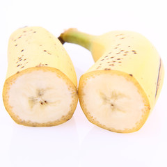 Banana cut in half on white background