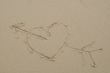 Heart drawn on sand.