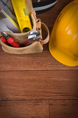 Construction equipments on wood background with copy space.