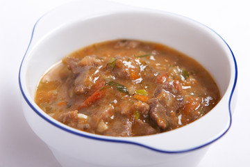 Meat stew with vegetables and herbs