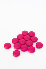 Obraz na płótnie Canvas Real pink medicine pill drug tablet group on white background