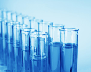 Test-tubes on blue background