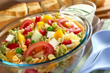 Pasta salad with fresh vegetables and cheese