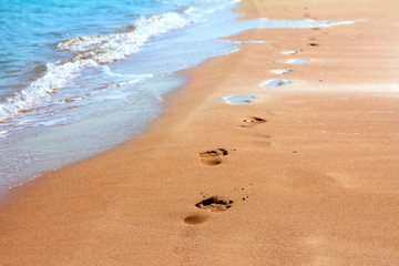 footprints on sand beach