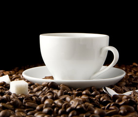 cup of coffee and beans on black