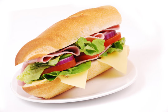 sandwich with ham and vegetables on white background