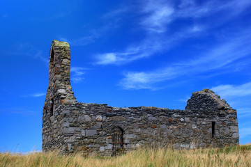 Ruined church against a blue sky