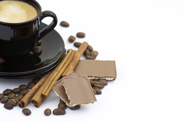 cup of italian espresso with cinnamon, coffee beans and chocolat