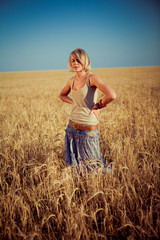 Image of young woman on wheat field