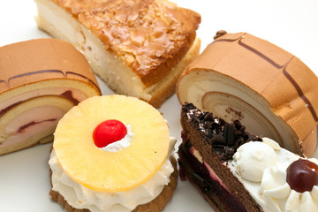 variety of cake on a white background