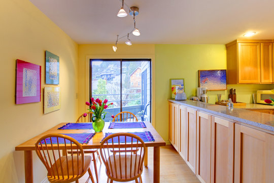 Happy yellow and purple kitchen and dining table