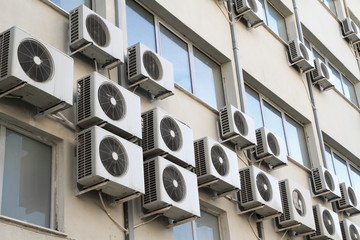 Air conditioning units on public building exterior - 30855546