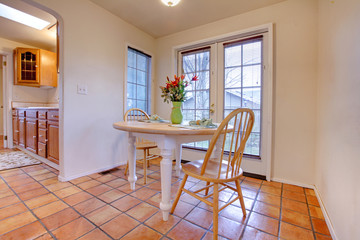 Happy dining room with orange tile floor