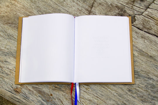 White blank page sketch book on wood table horizontal