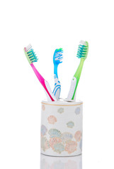 Three dental toothbrushes decorative glass