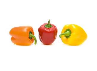 peppers of different colors on a white background