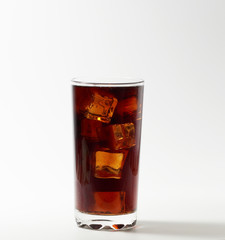 Fototapeta na wymiar Glass of cola with ice cubes