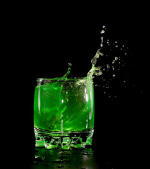 Orange in green water splash