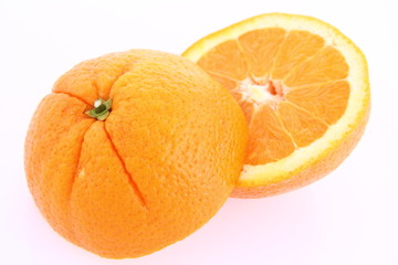 Orange, cut in half, on white background