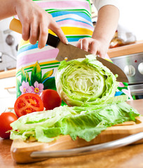 Woman's hands cutting vegetables