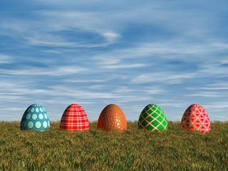 Easter eggs laying in a grass meadow