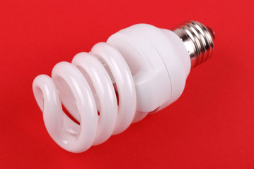 energy saving bulb on red