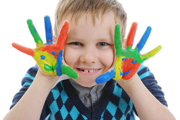 smiling boy with the palms painted by a paint.