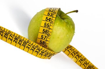 green apple and measurement tape
