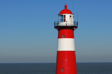 Fototapeta premium Red lighthouse in Zeeland, Netherlands
