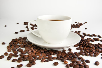 coffee cup and coffee beans on white background