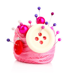 Few pins in wool ball isolated on white