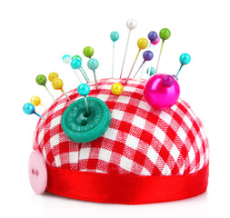 Colored pinheads in pin-cushion isolated on white