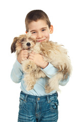 Boy loving his puppy dog