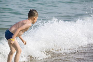 The boy has a fun in water