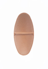 Single pink pill, isolated
