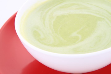 Pea and mozzarella soup in a bowl