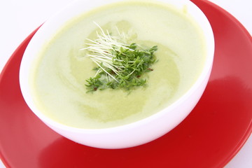 Pea and mozzarella soup decorated with cress