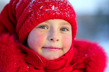 The pink-checked girl in red on a frost